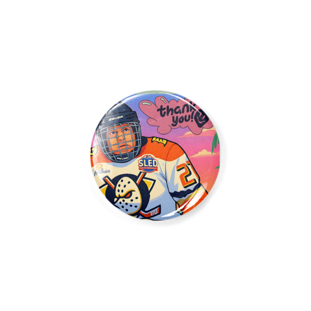 Button badge with hockey-themed design featuring a helmet, jersey, and 'thank you' text on a white background.